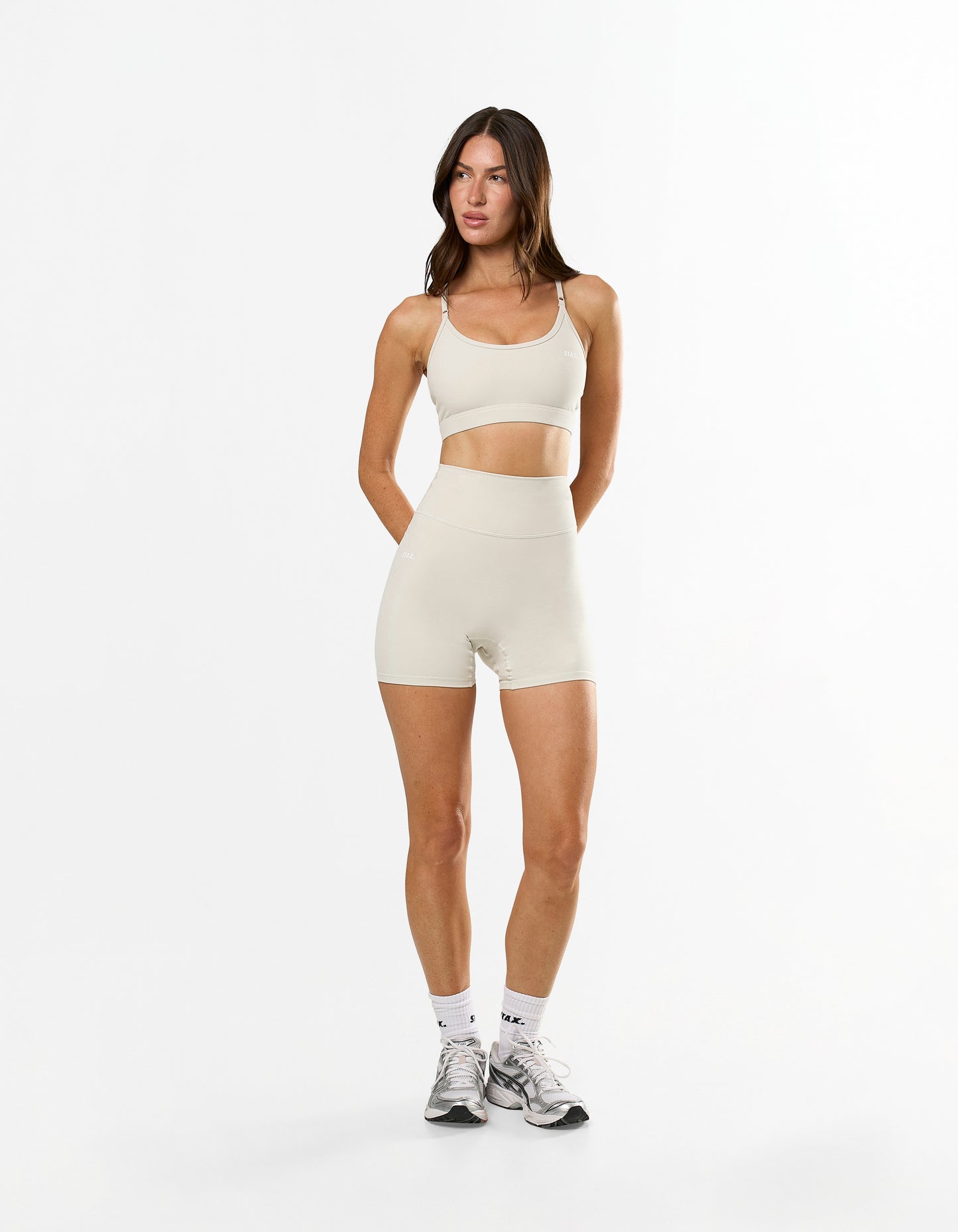 Front view of model wearing STAX. NFS Midi Bike Shorts NANDEX™ in Oat with high waist flattering fit