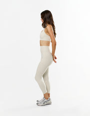 Side profile of STAX. NFS 7/8 Tights NANDEX™ in Oat showing flattering 7/8 length