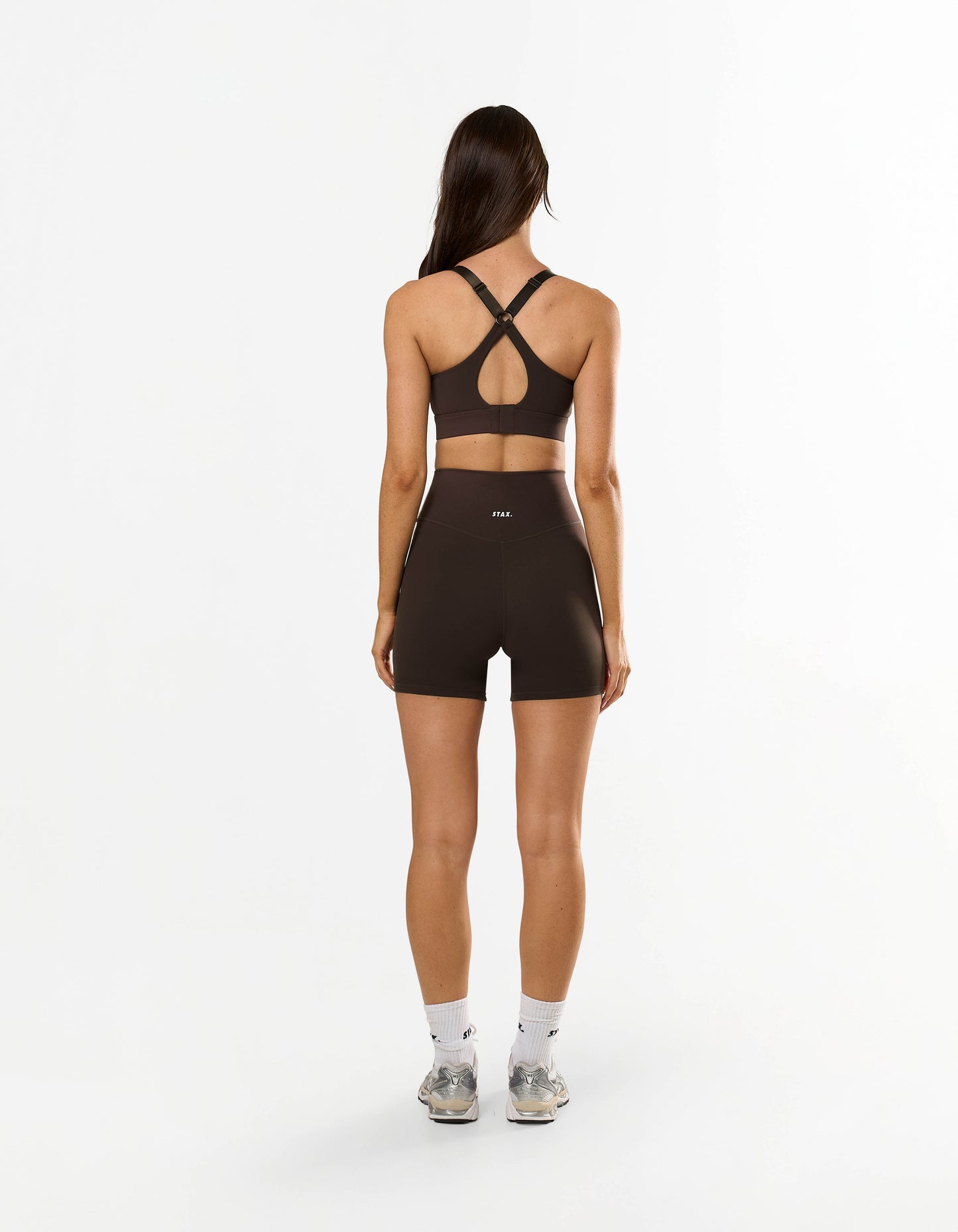 Back view of STAX. NFS (No Front Seam) Midi Bike Shorts NANDEX™ in Espresso with matching sports bra showing racerback design 