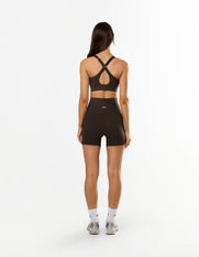Back view of STAX. NFS (No Front Seam) Midi Bike Shorts NANDEX™ in Espresso with matching sports bra showing racerback design 