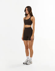Side profile of STAX. NFS (No Front Seam) Midi Bike Shorts NANDEX™ in Espresso showing flattering high waisted fit