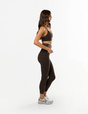 Side profile of STAX. NFS (No Front Seam) 7/8 Tights NANDEX™ in Espresso showing flattering tight fit 