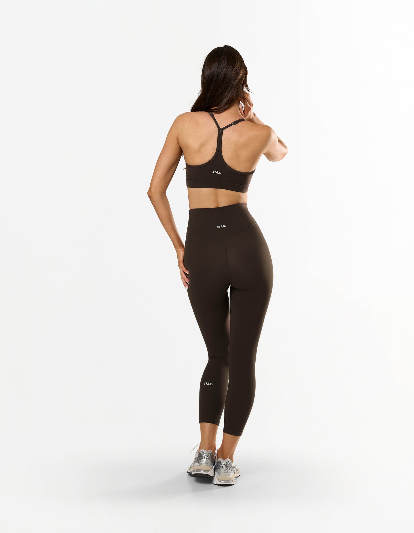 Back view of STAX. NFS (No Front Seam) 7/8 Tights NANDEX™ in Espresso showing matching sports bra with flattering thin strap design