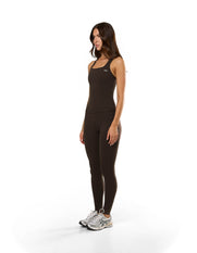 Side view of model wearing STAX. Body Tank NANDEX™ in Espresso with low cut scoop neck design