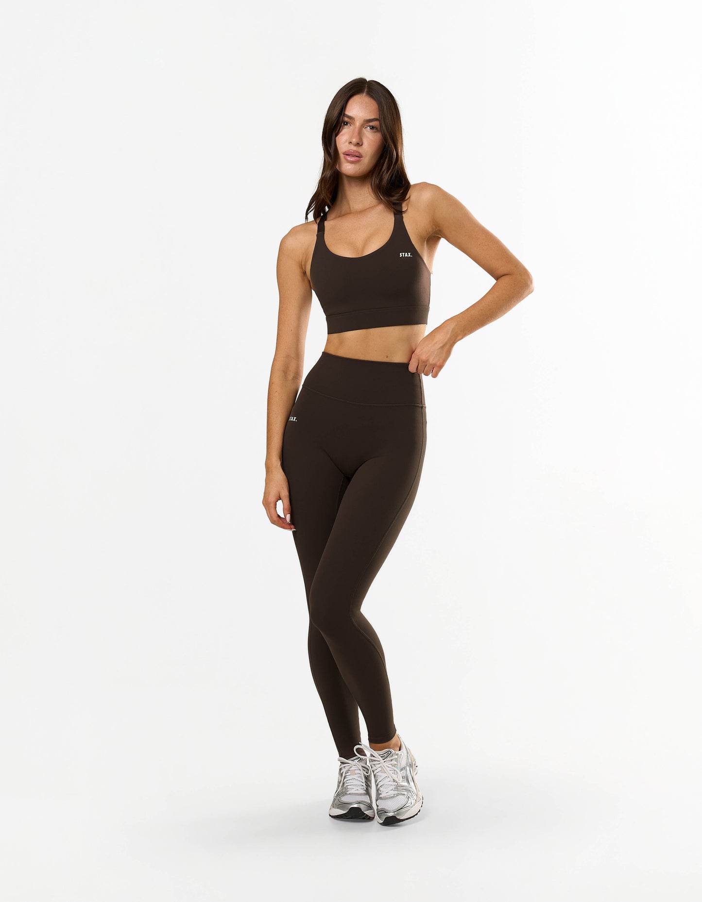 Front view of model wearing STAX. NFS (No Front Seam) Full Length Tights NANDEX™ in Espresso with medium support sports bra