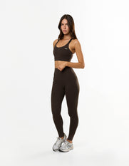 Front view of model wearing STAX. NFS (No Front Seam) Full Length Tights NANDEX™ in Espresso with matching sports bra