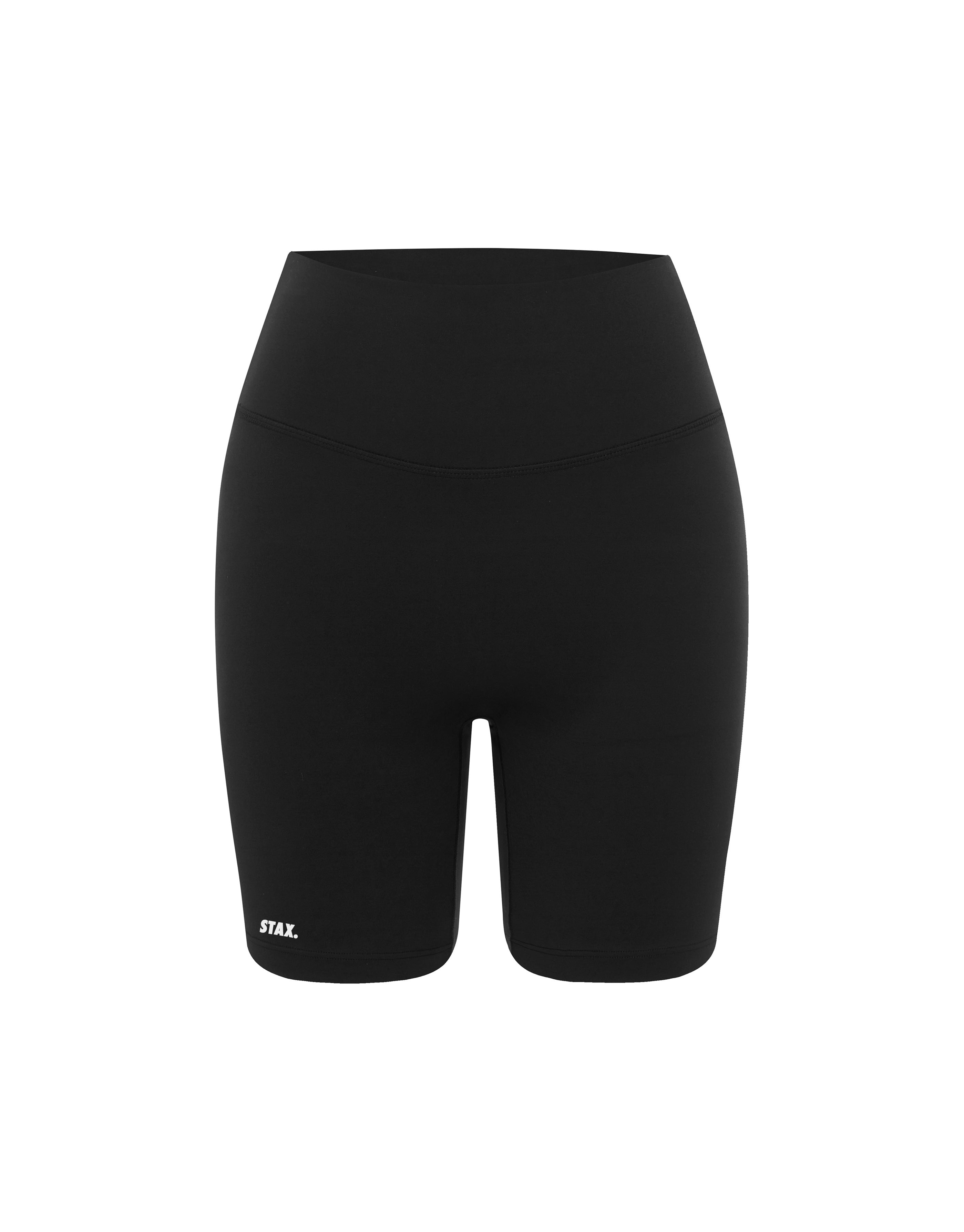 Flat lay front view of STAX. Midi Bike Shorts airlyte in Black isolated on a white background  