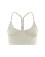 Flat lay back view of STAX. Strappy Crop NANDEX™ in Oat showing small white logo 