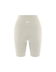 Flat lay back view of STAX. NFS Midi Bike Shorts NANDEX™ in Oat showing small white logo 