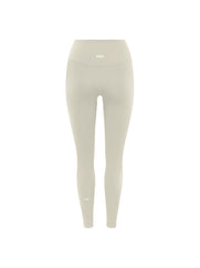 Flat lay back view of STAX. NFS 7/8 Tights NANDEX™ in Oat showing small white logo 