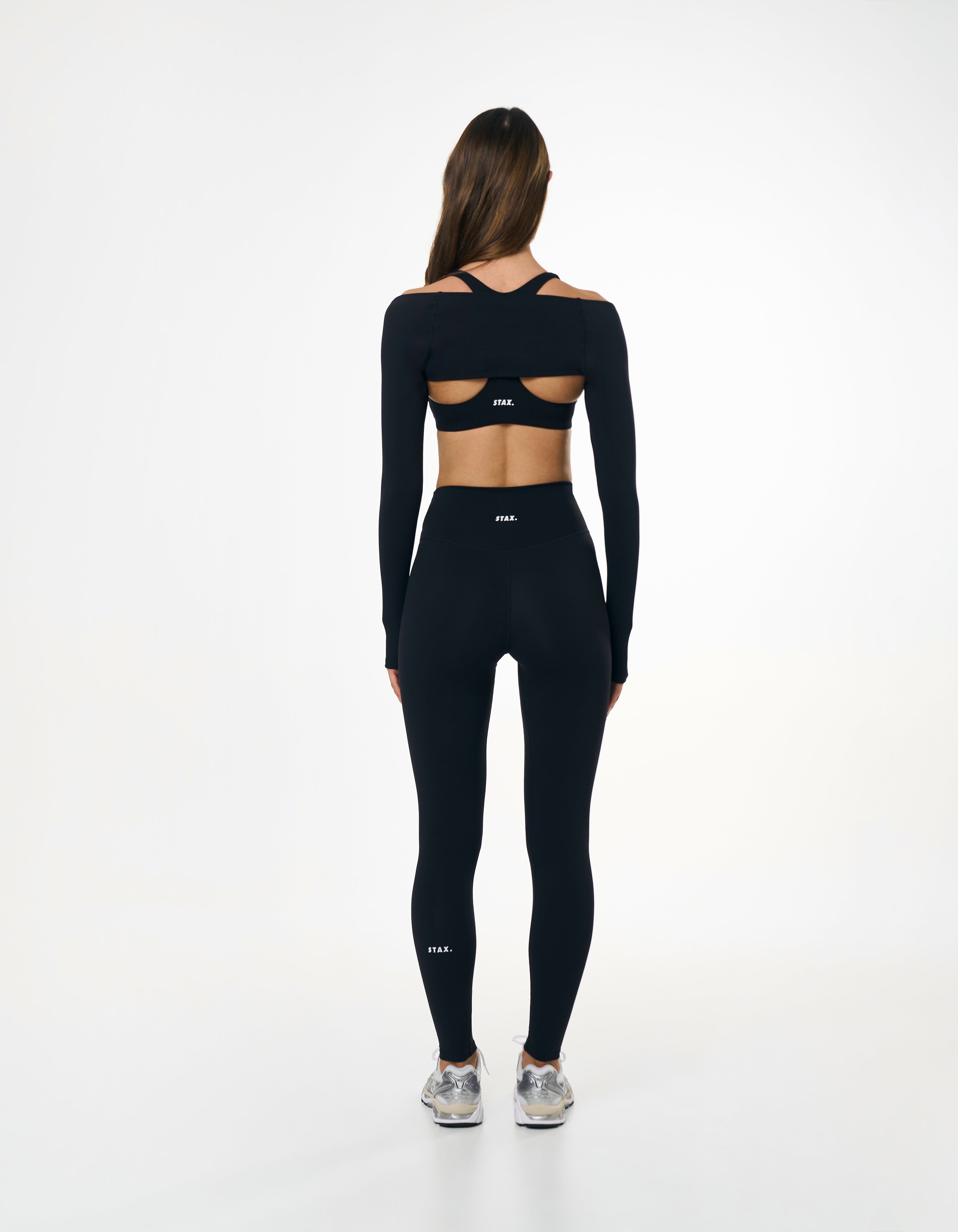 Back view of STAX. Full Length Tights NANDEX™ Original in black showing flattering design and white logo 