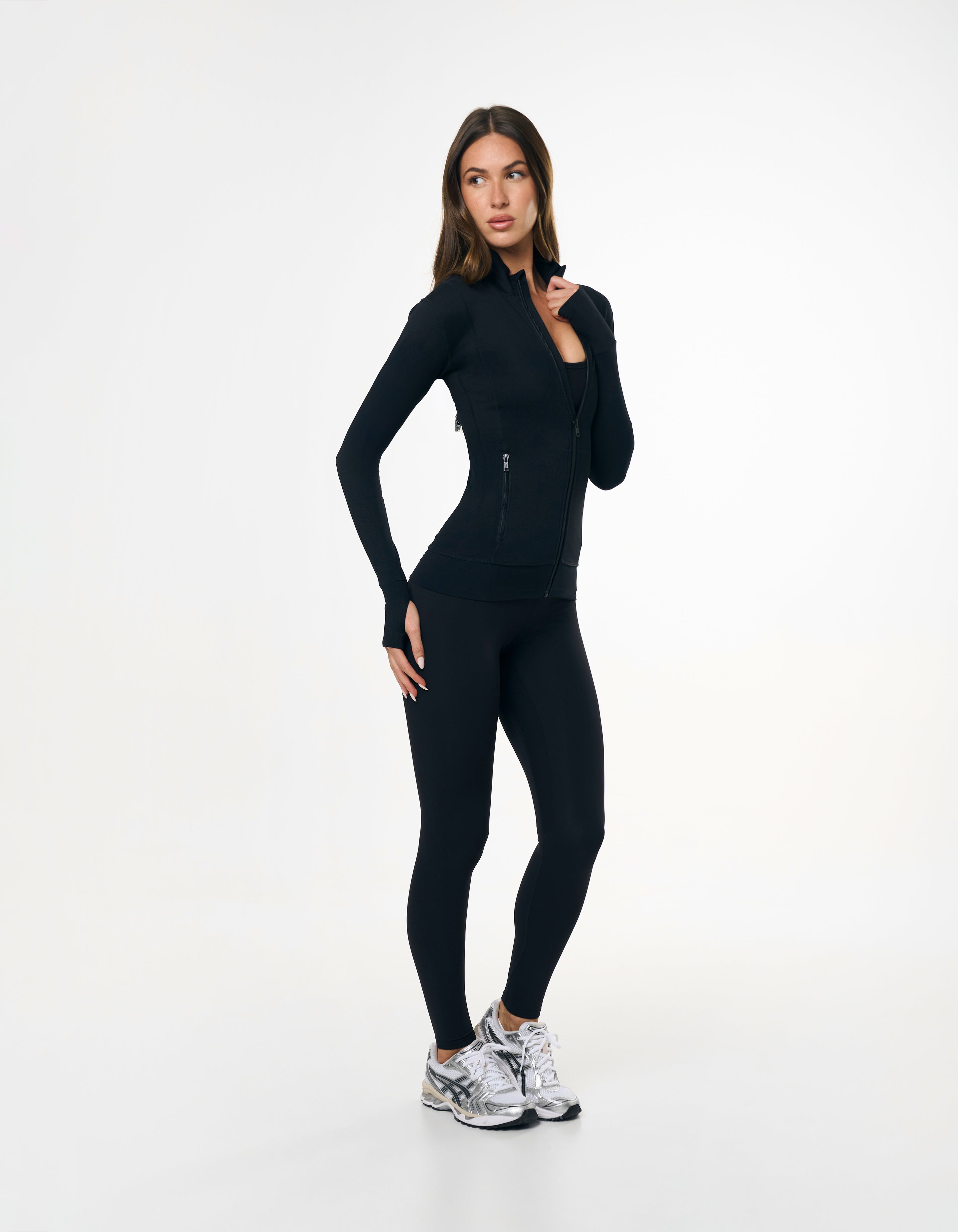Front view of model wearing STAX. Full Length Tights NANDEX™ Original in Black  with matching Zip Jacket with thumb holes